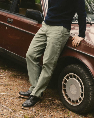 fit model posing in The Surplus Pant in Field Olive Reverse Sateen