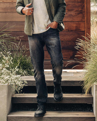 fit model walking in The Moto Boot in Black Weatherproof Nubuck