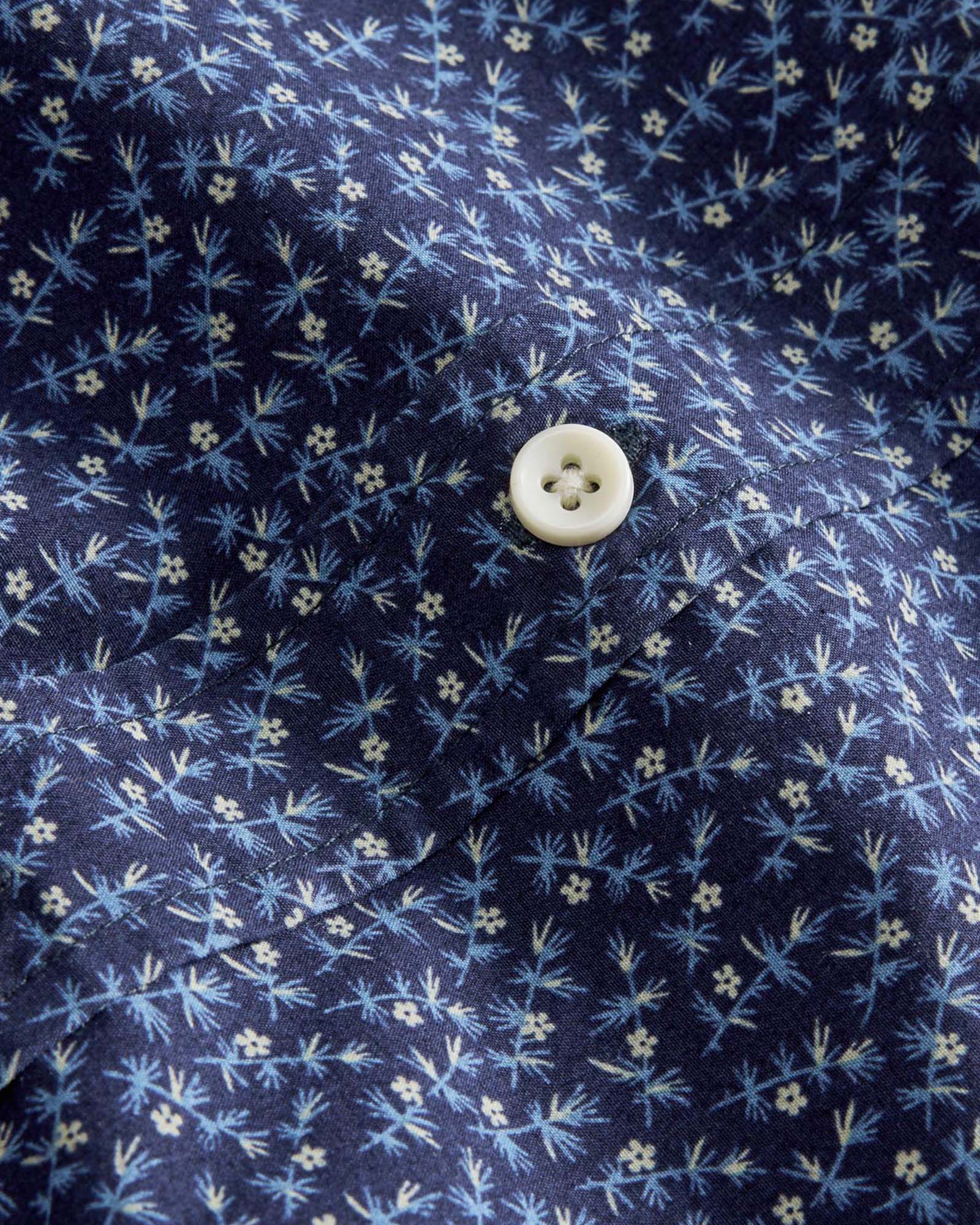material shot of the buttons on The Short Sleeve Jack in Falling Floral, Wovens by Taylor Stitch