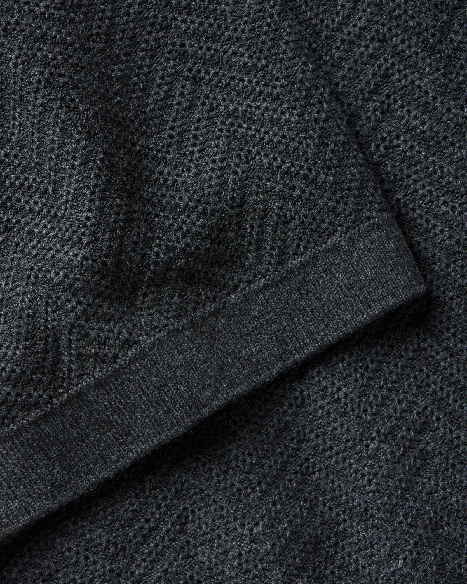 material shot of the sleeve on The Button Down Polo in Charcoal Herringbone, Knits by Taylor Stitch