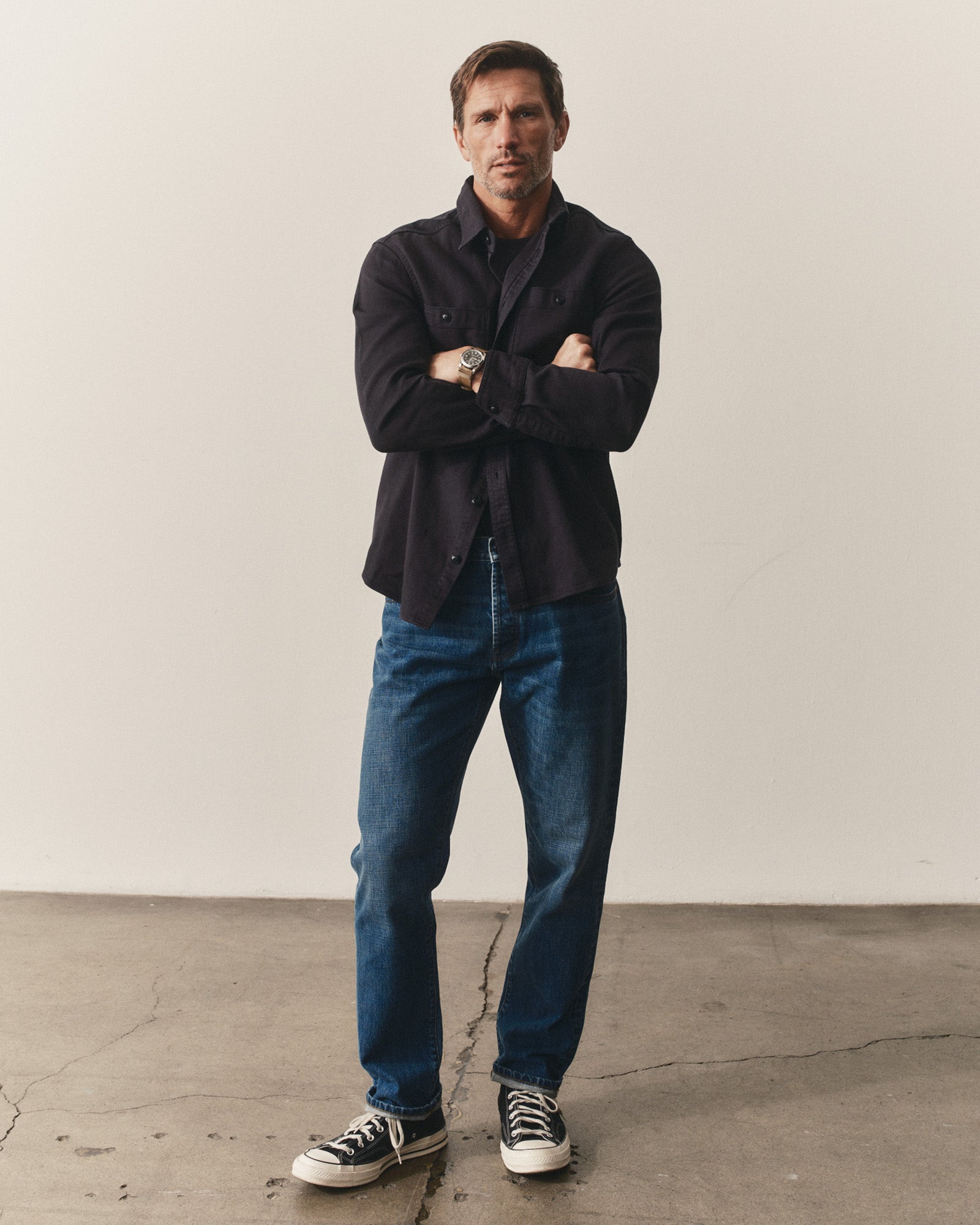 fit model posing in The Dispatch Shirt in Navy Broken Twill, Wovens by Taylor Stitch