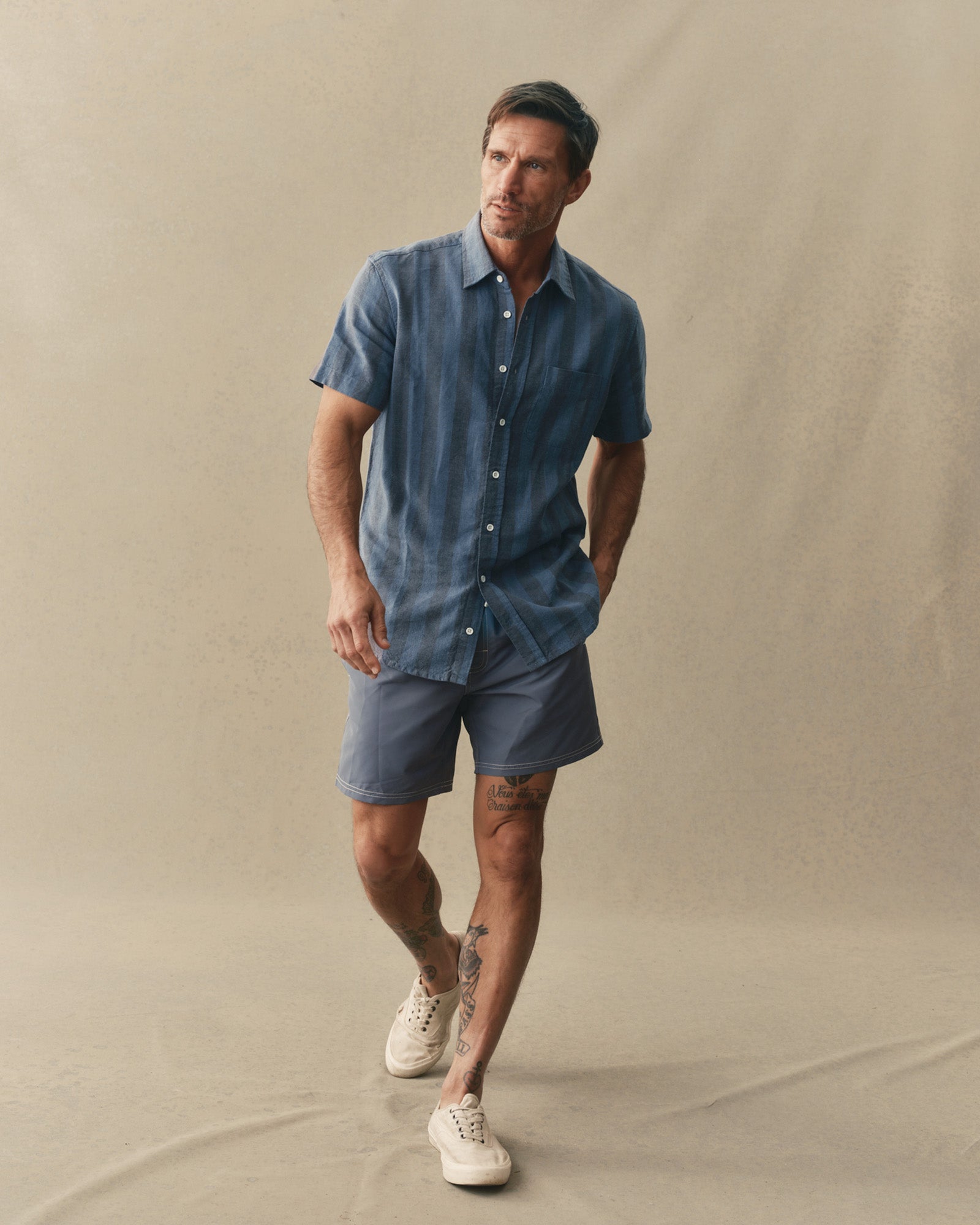 fit model posing in The Short Sleeve California in Blue Stone Stripe Hemp, Wovens by Taylor Stitch
