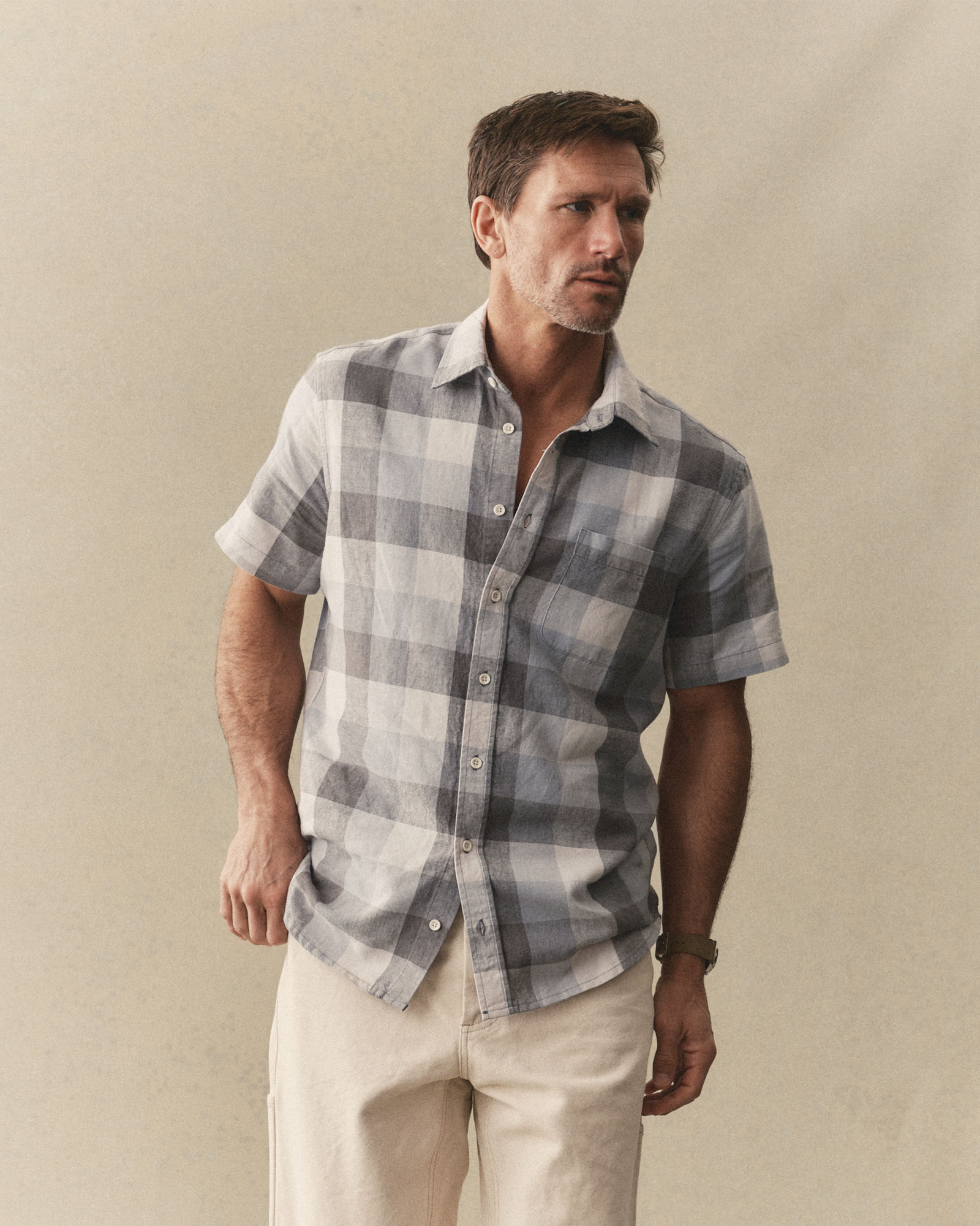 fit model showing off The Short Sleeve California in Overcast Check Hemp, Wovens by Taylor Stitch