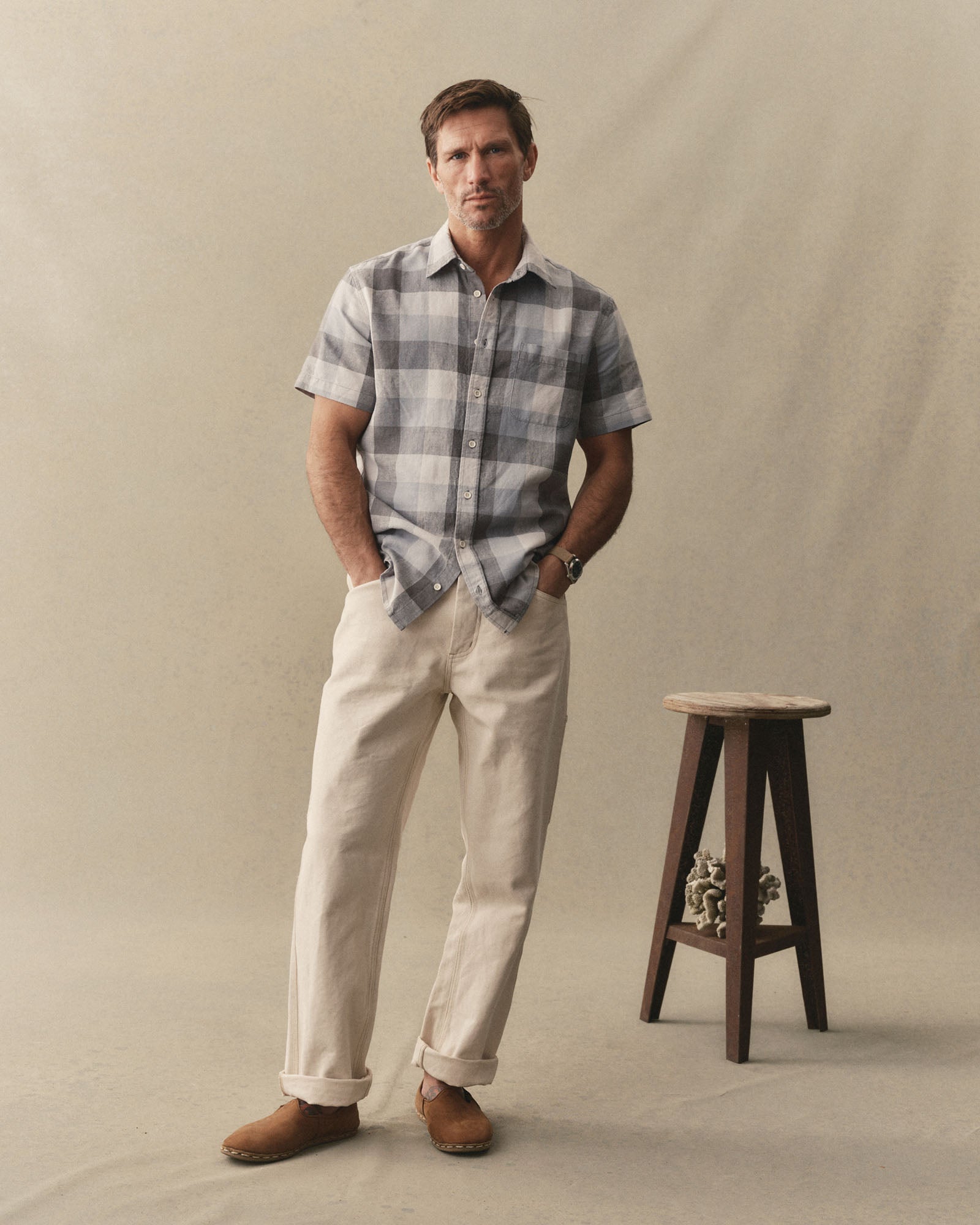 fit model posing in The Short Sleeve California in Overcast Check Hemp, Wovens by Taylor Stitch
