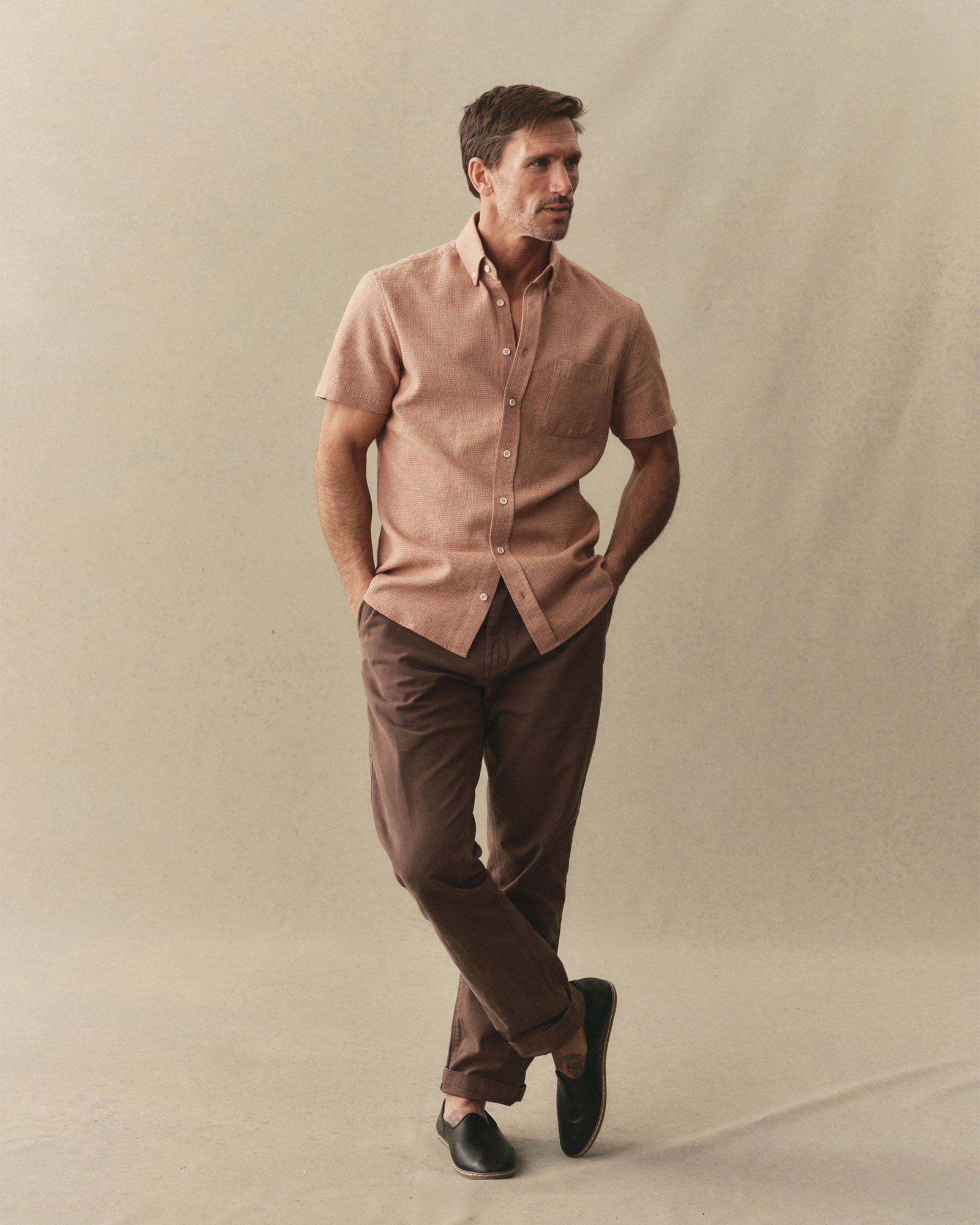fit model posing in The Short Sleeve Jack in Desert Twist Waffle, Wovens by Taylor Stitch