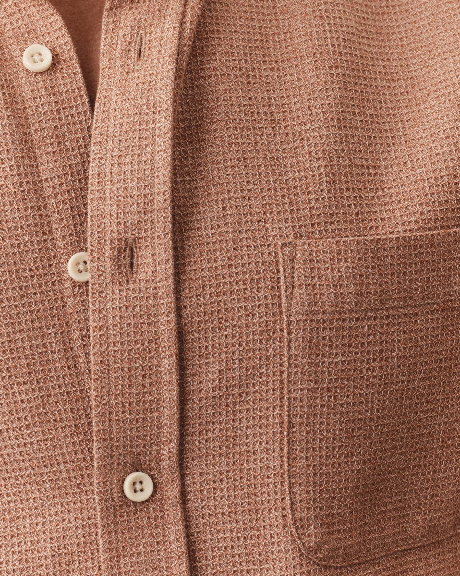 fit model showing off the pocket on The Short Sleeve Jack in Desert Twist Waffle, Wovens by Taylor Stitch
