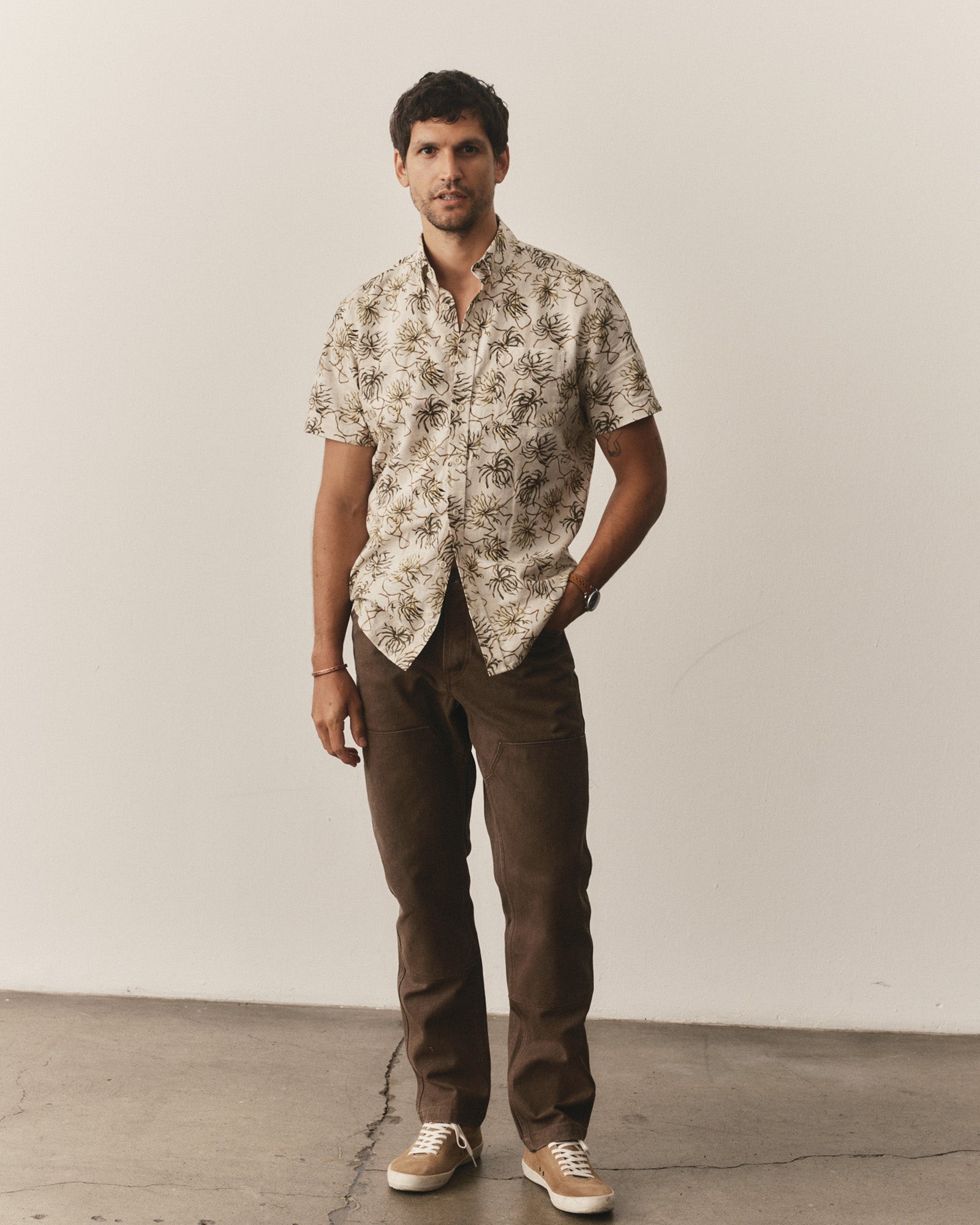 fit model posing in The Short Sleeve Jack in Dried Palms, Wovens by Taylor Stitch
