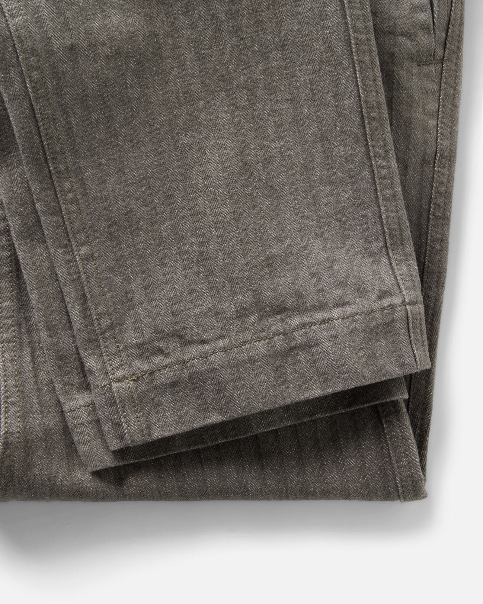 material shot of the hem on The Emlen Pant in Smoked Olive Herringbone, Bottoms by Taylor Stitch