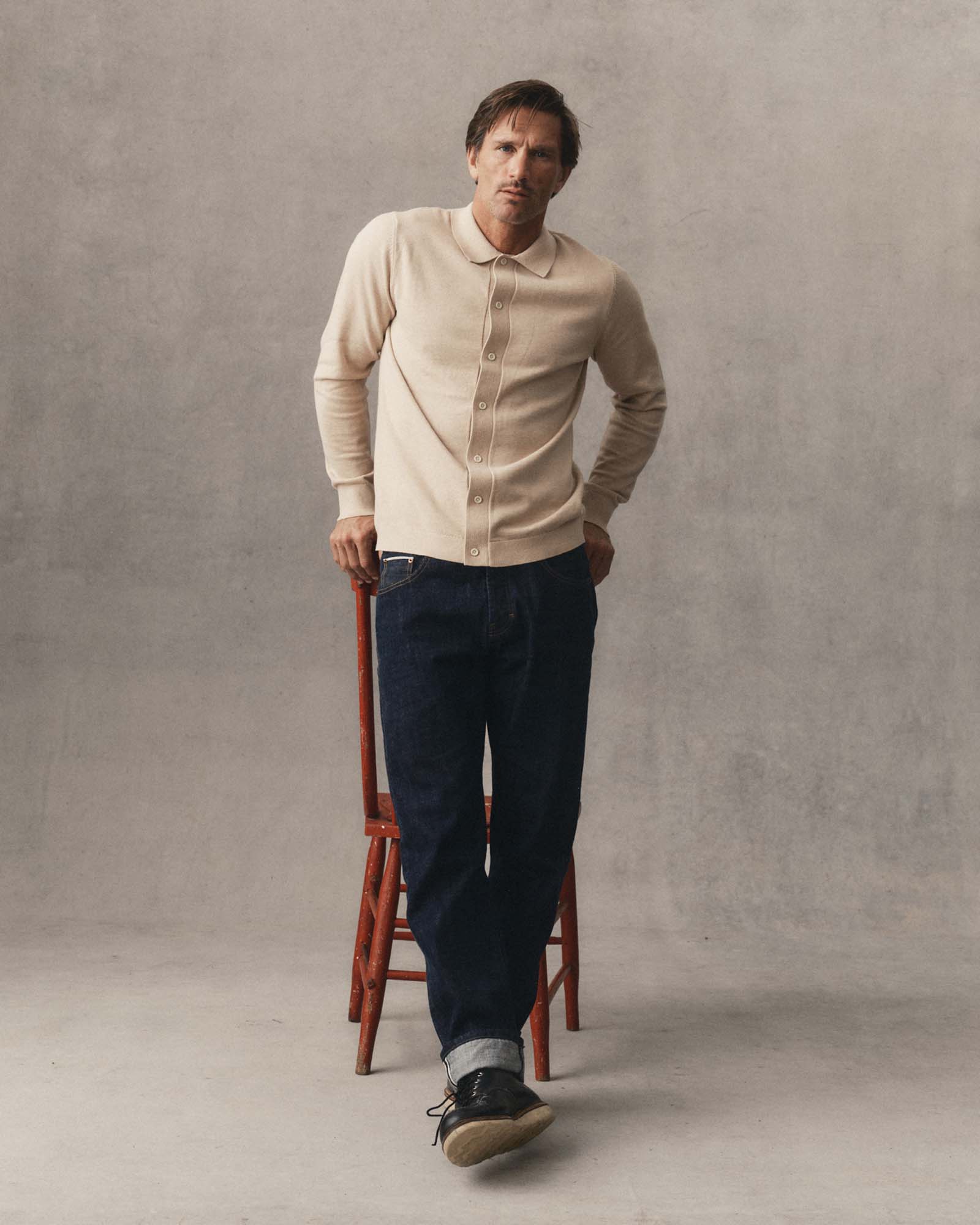 fit model showing off The Nichols Polo in Sable Cotton Cashmere, Knits by Taylor Stitch