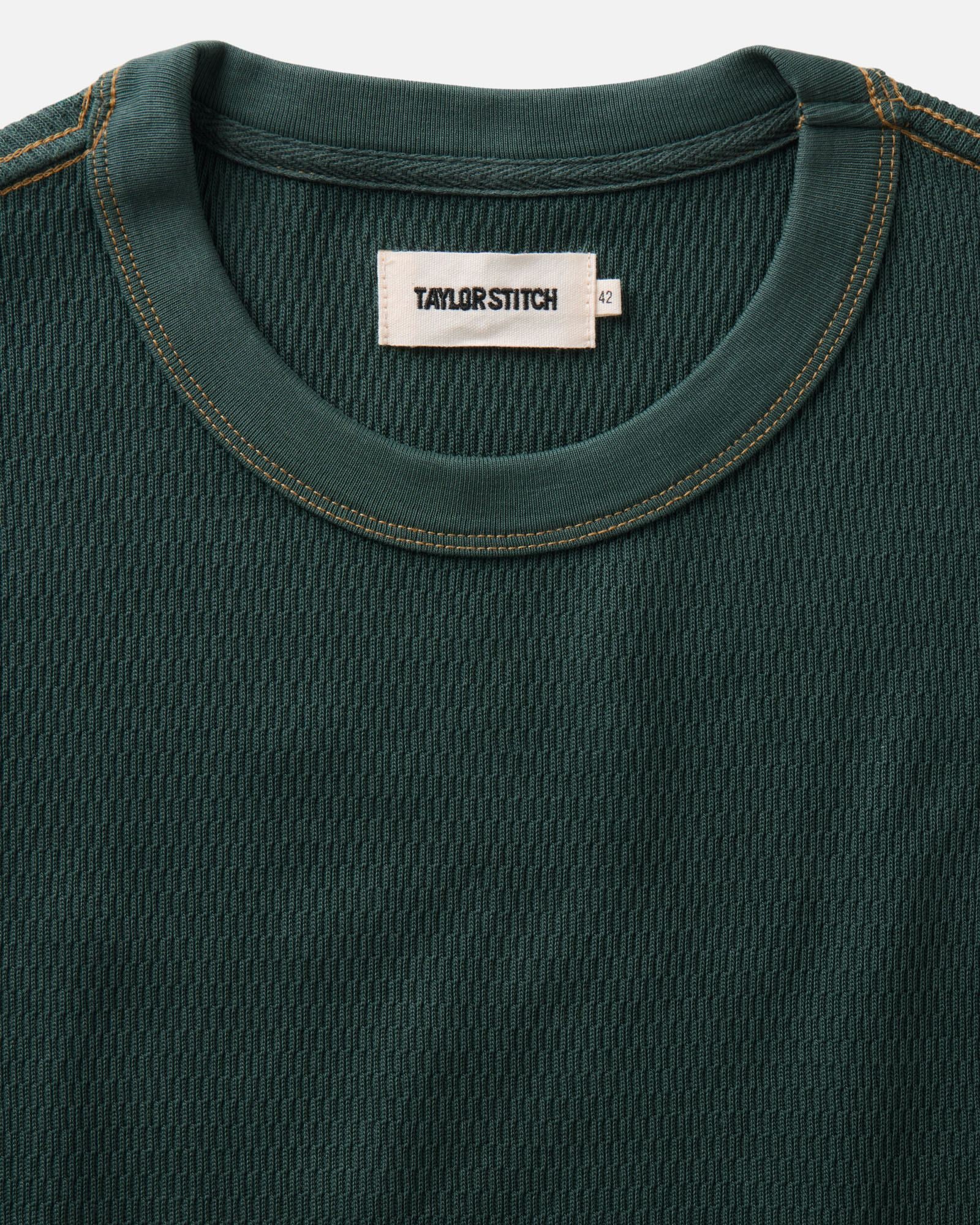 material shot of the collar on The Organic Cotton Short Sleeve Crew in Dark Forest Waffle, Knits by Taylor Stitch