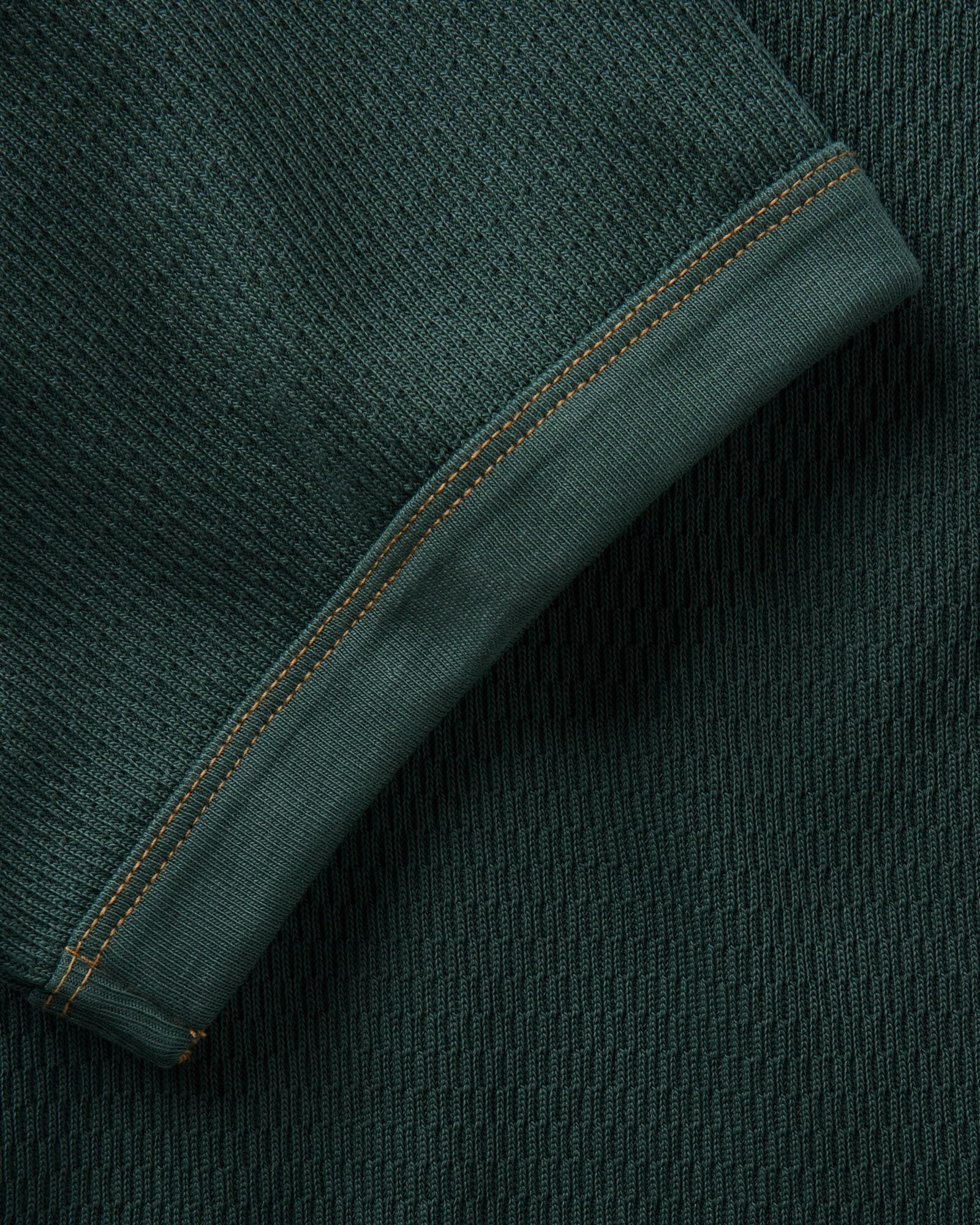 material shot of the sleeve on The Organic Cotton Short Sleeve Crew in Dark Forest Waffle, Knits by Taylor Stitch