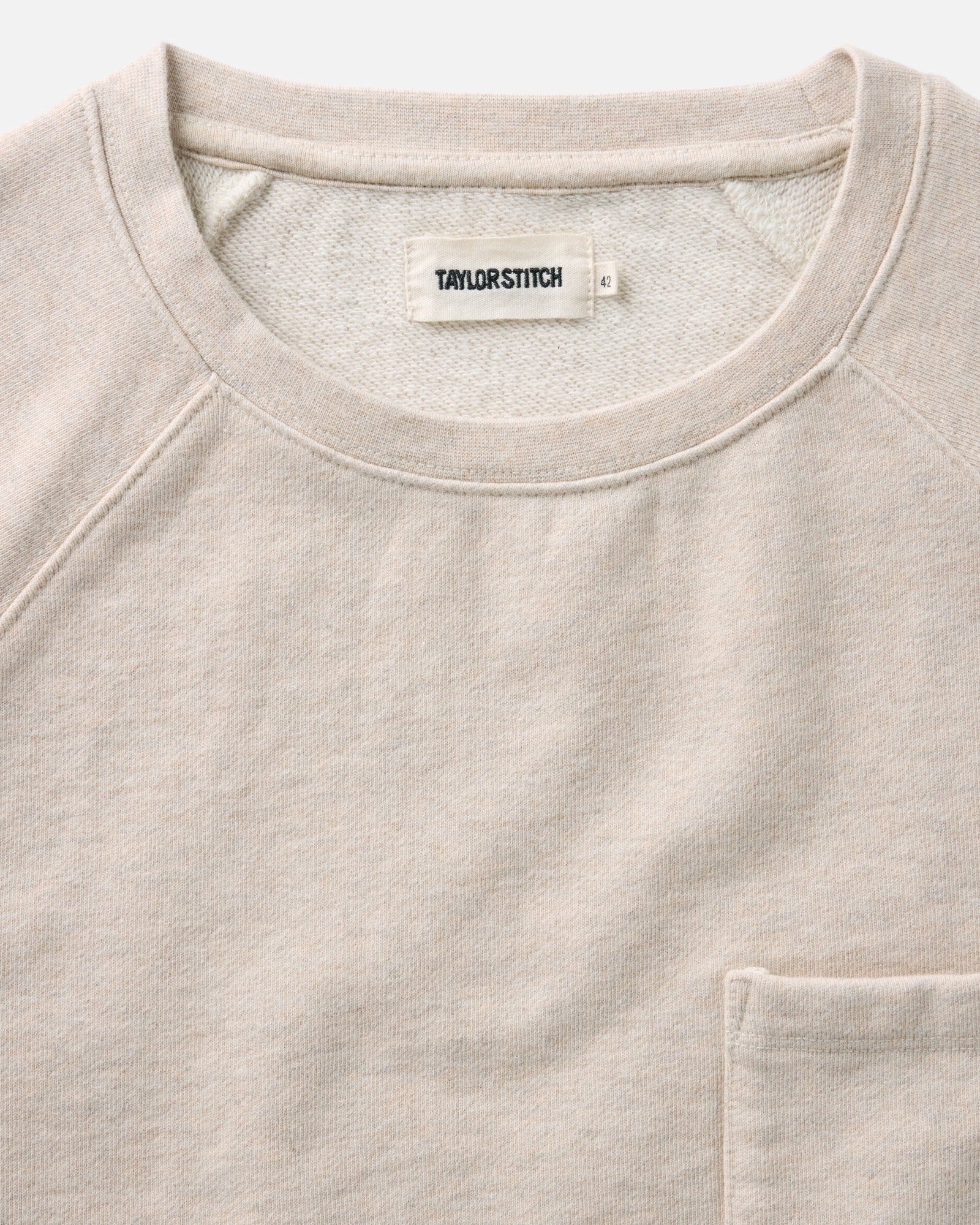 material shot of the collar on The Short Sleeve Sunset Crew in Heather Oat Terry, Knits by Taylor Stitch