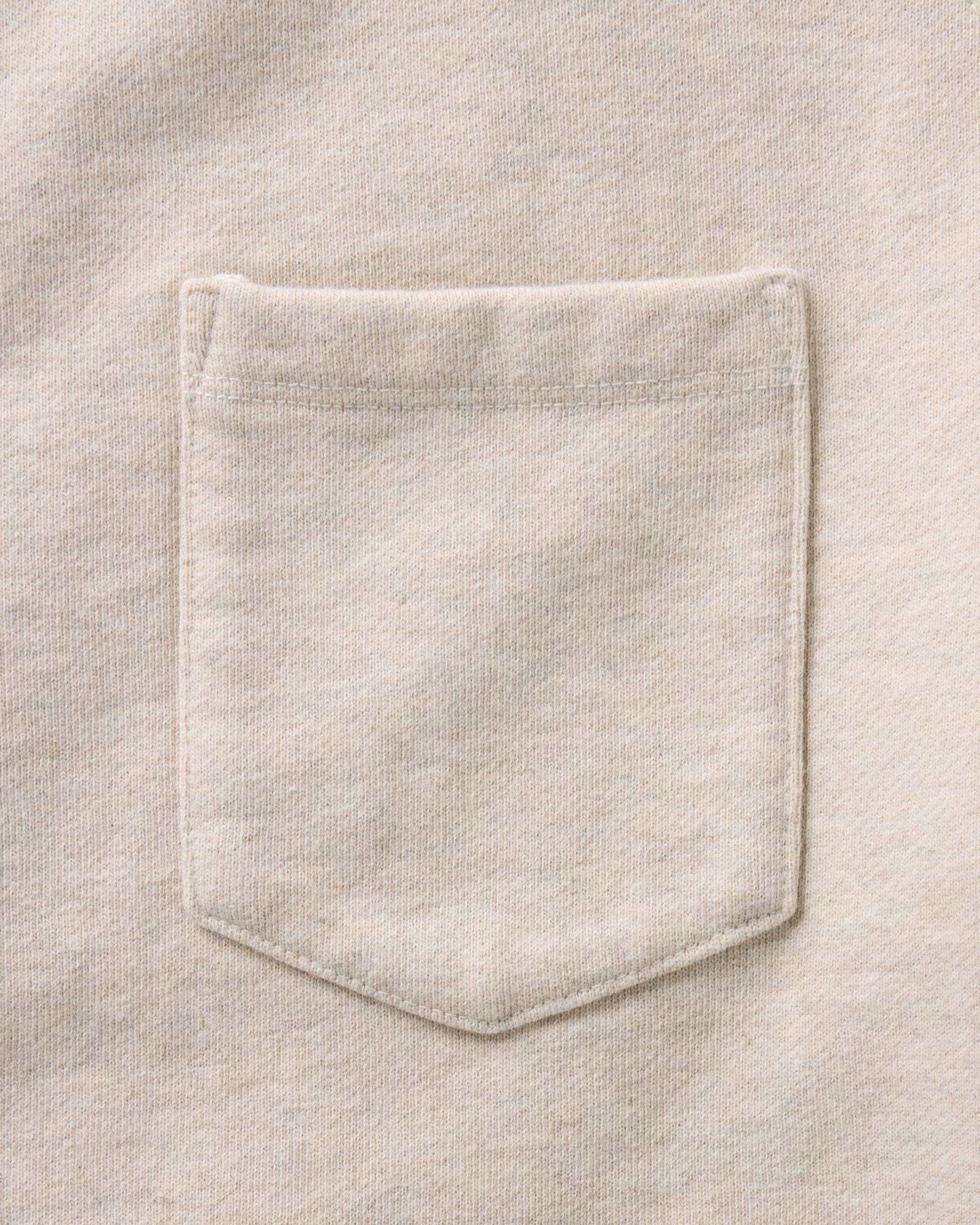 material shot of the pocket on The Short Sleeve Sunset Crew in Heather Oat Terry, Knits by Taylor Stitch