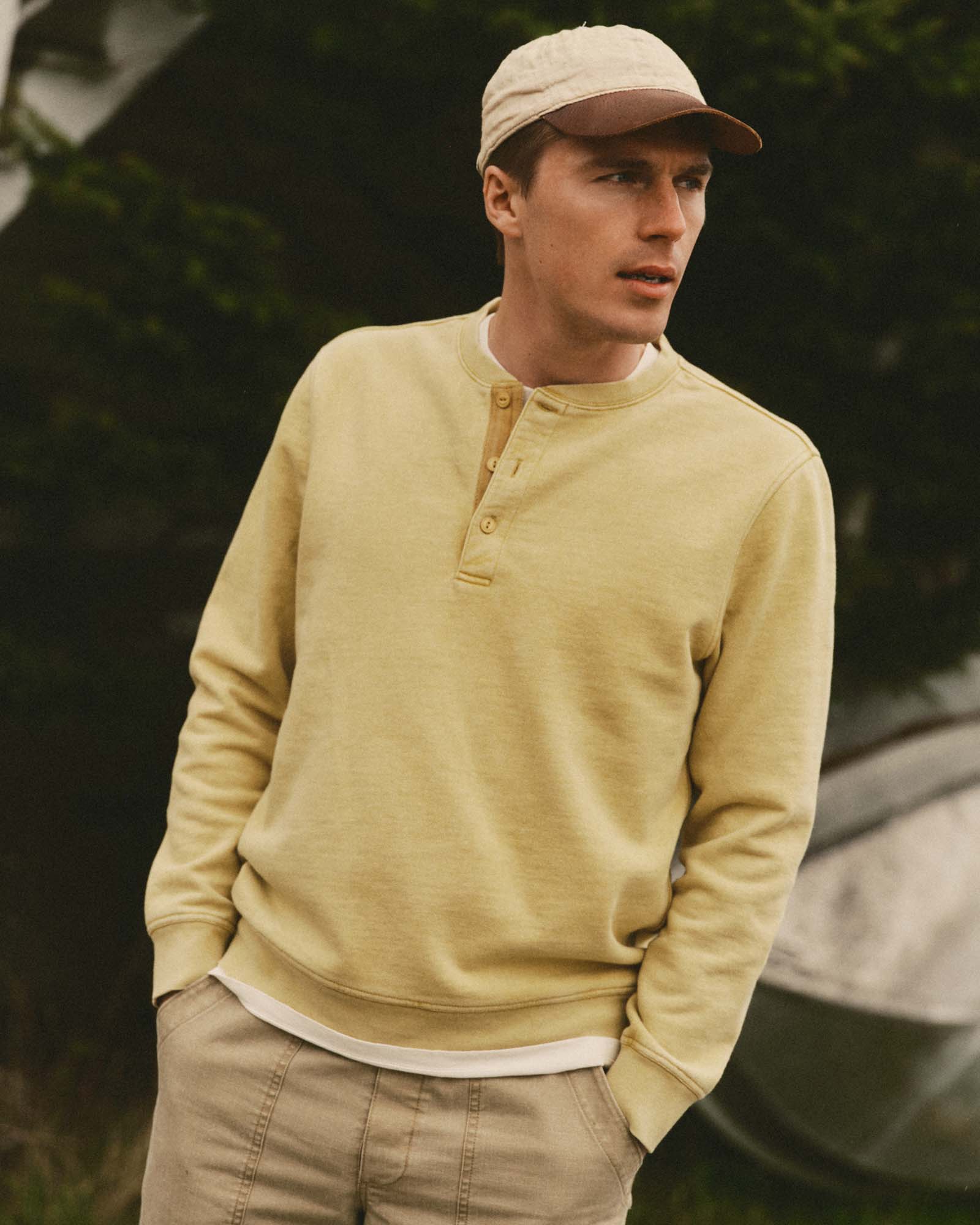 fit model showing off The Sunset Henley in Washed Goldfinch Terry, Knits by Taylor Stitch