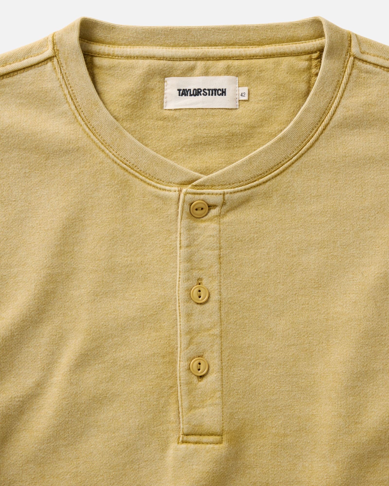 material shot of the collar on The Sunset Henley in Washed Goldfinch Terry, Knits by Taylor Stitch