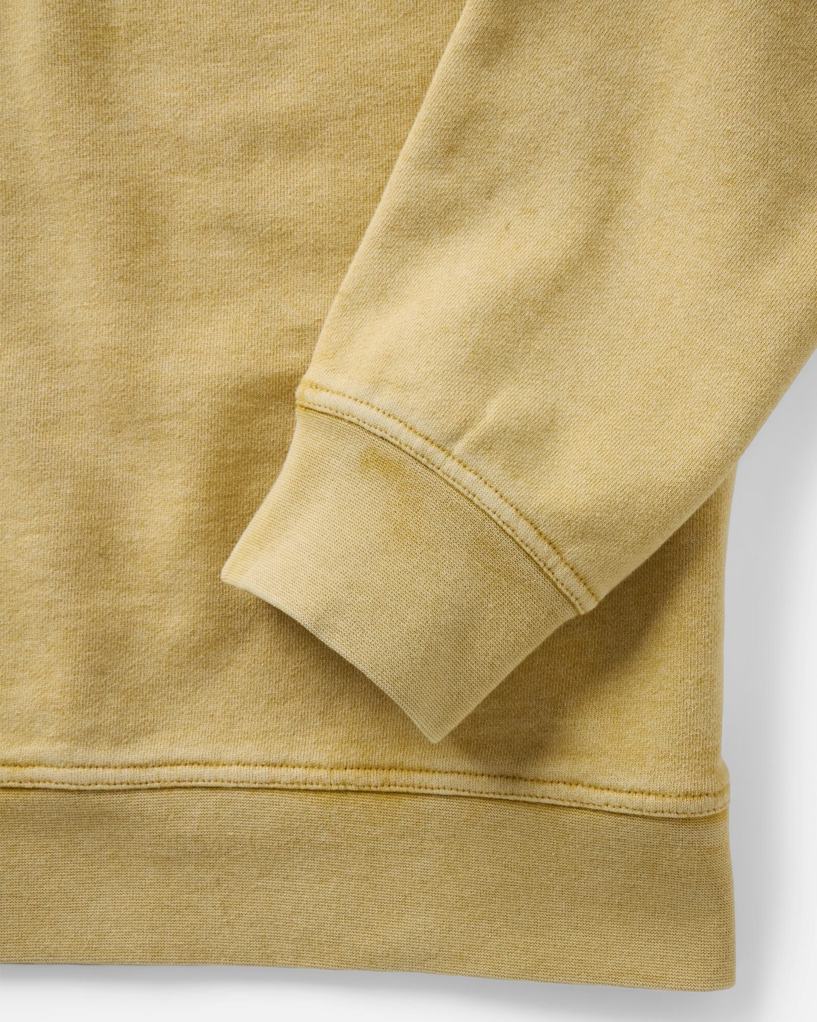 material shot of the sleeve on The Sunset Henley in Washed Goldfinch Terry, Knits by Taylor Stitch