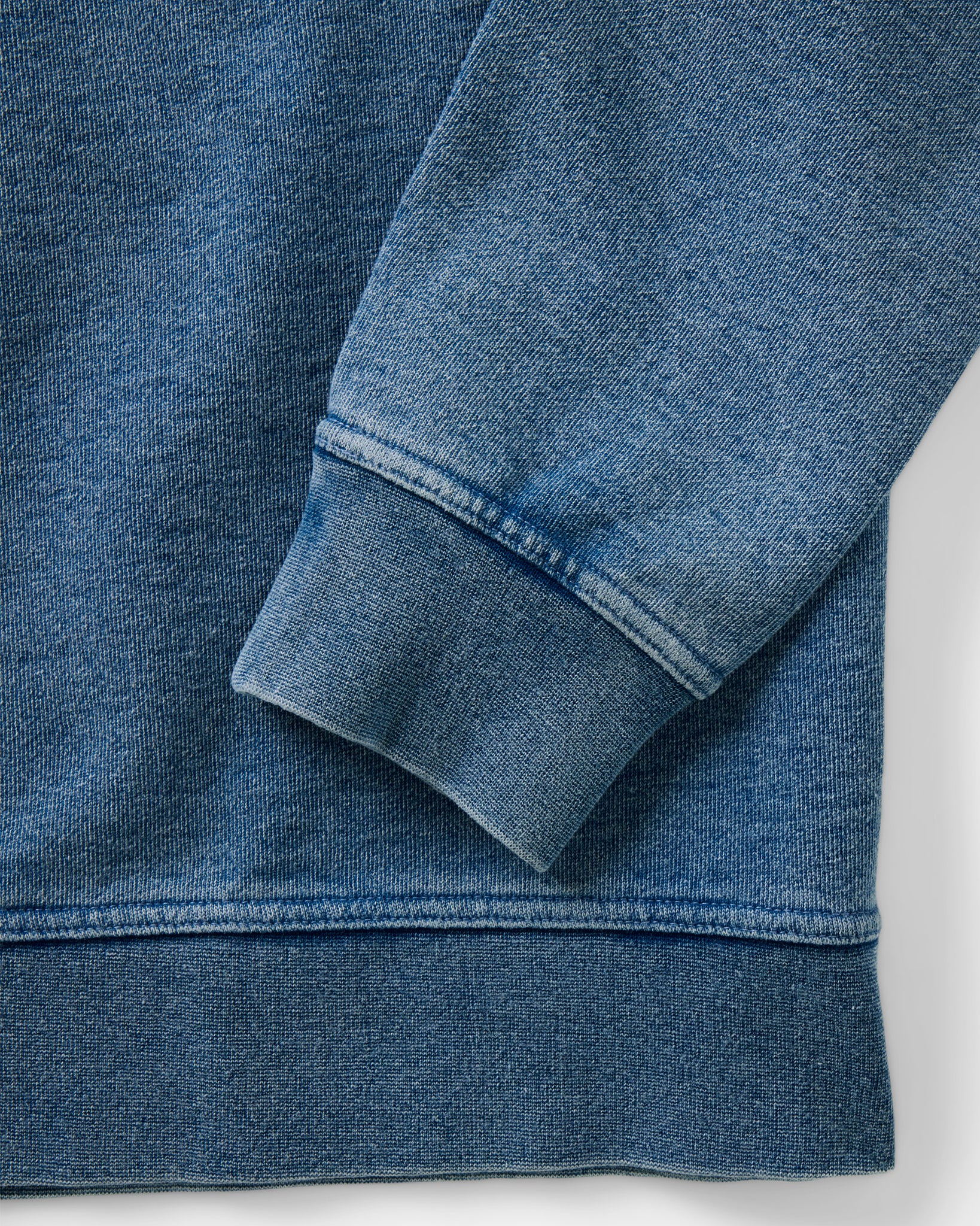 material shot of the sleeve on The Sunset Henley in Washed Indigo Terry, Knits by Taylor Stitch