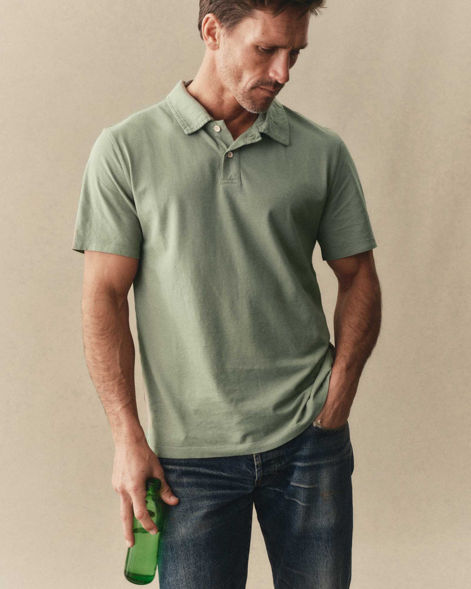 fit model posing in The Cotton Hemp Polo in Sage, Knits by Taylor Stitch