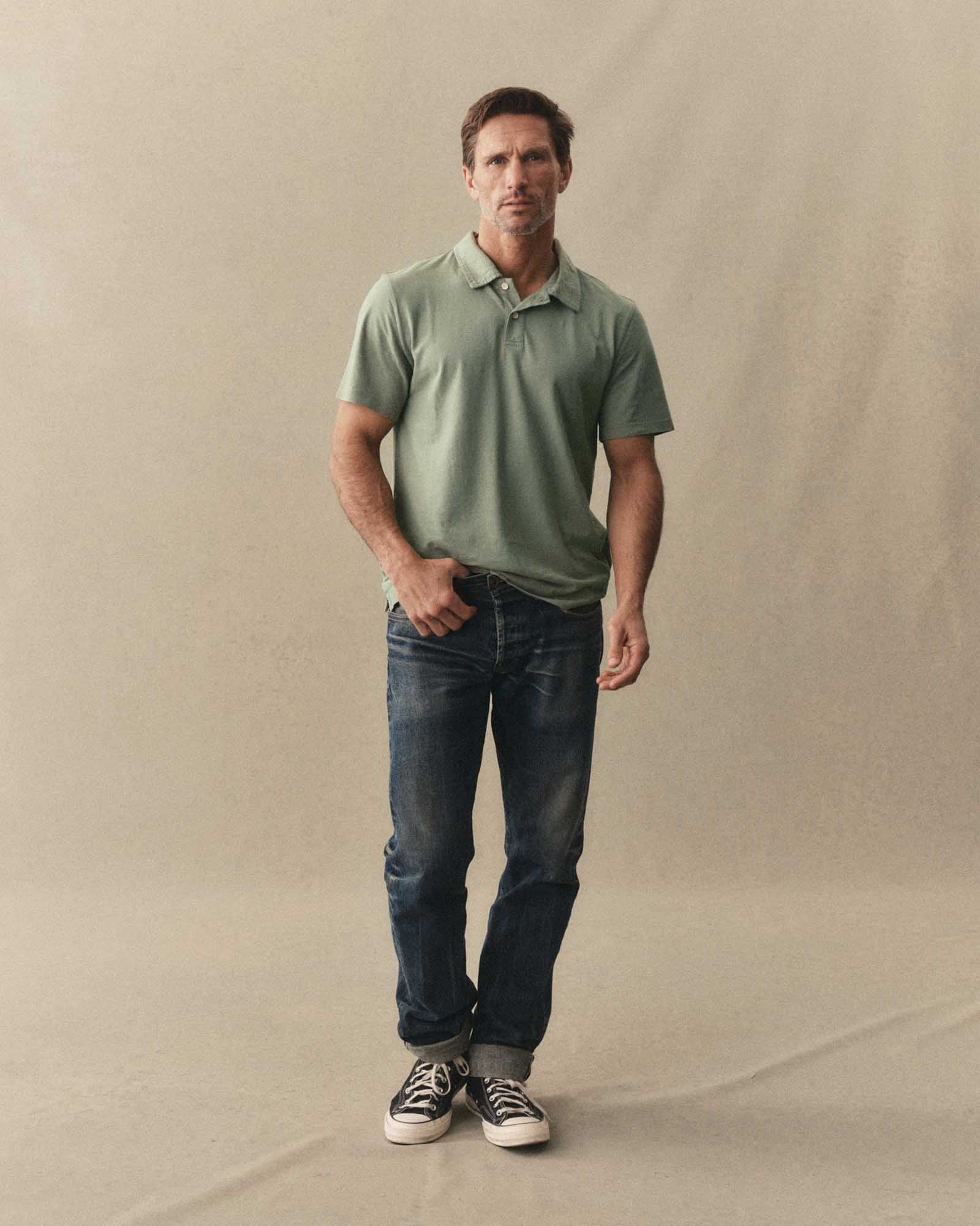 fit model posing in The Cotton Hemp Polo in Sage, Knits by Taylor Stitch