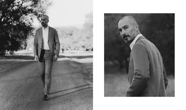 Fit model sitting wearing The Stevens Suit in Coffee Linen Herringbone