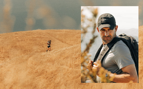 Michael running with his GR1 backpack in a field