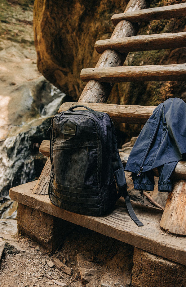 The GR1 Backpack on a wooden bench