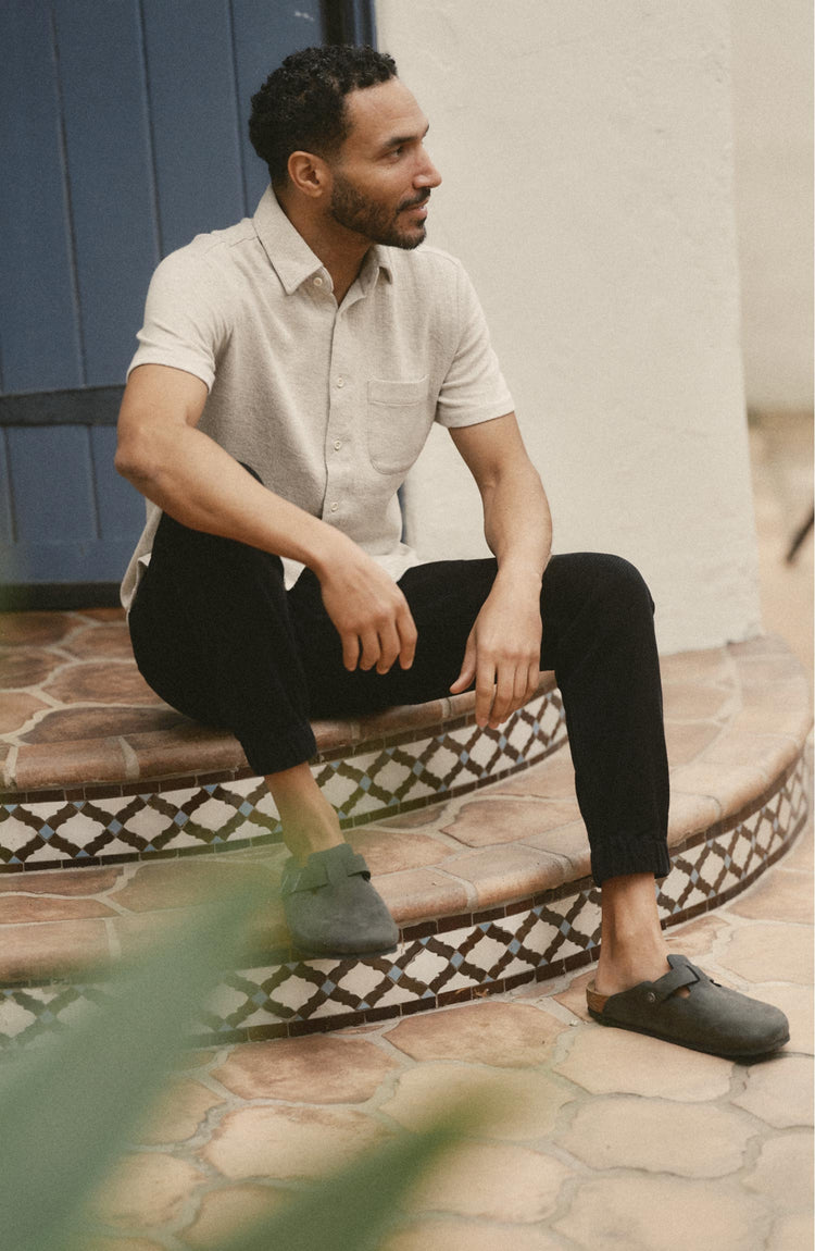 fit model sitting wearing The Apres Pant in Black Indigo Sashiko
