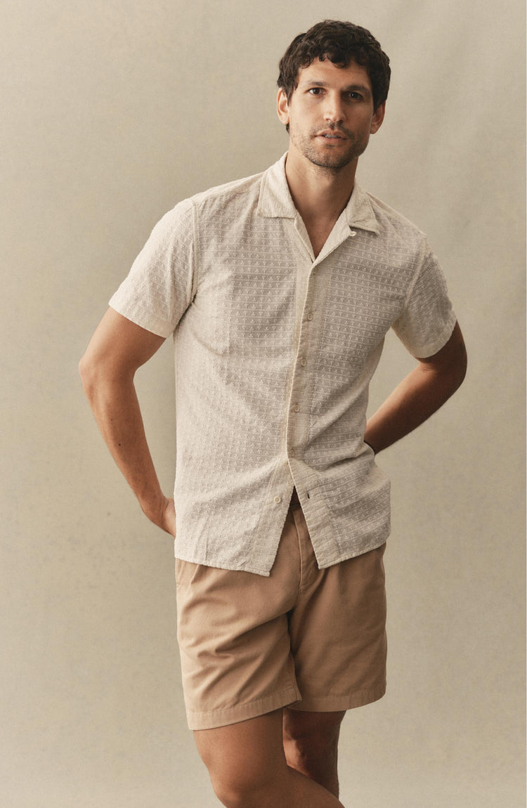 fit model posing in The Davis Shirt in Vintage White Embroidered Stripe