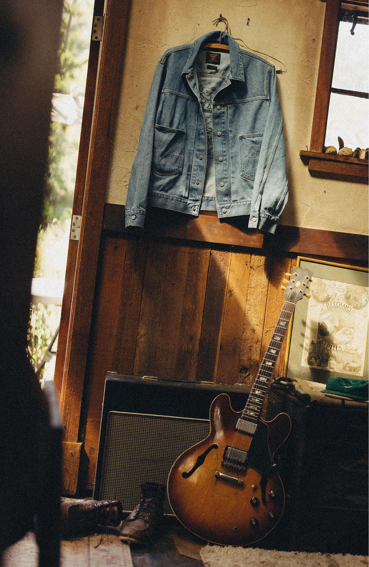 editorial image of The Haight Jacket in Light Wash Hemp Denim hanging
