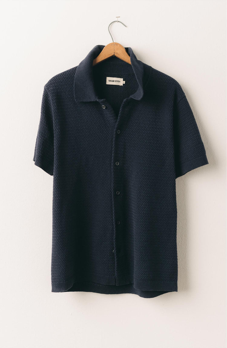 editorial image of The Button Down Polo in Dark Navy Crochet hanging