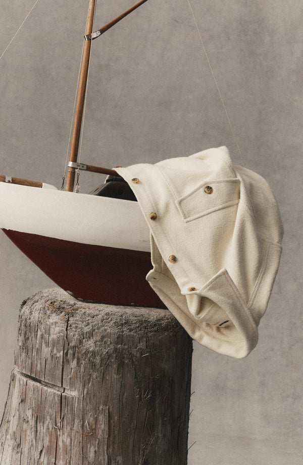 editorial image of The Maritime Shirt Jacket in Vintage White Moleskin Twill hanging