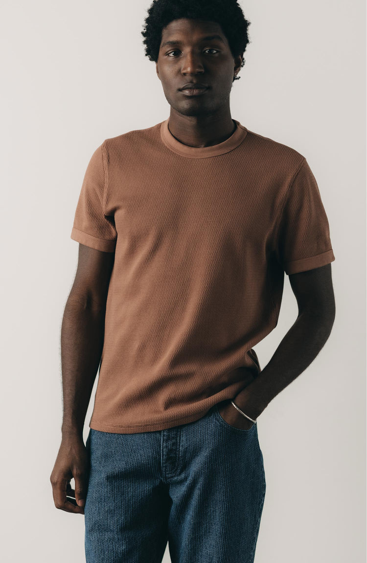 fit model posing in The Organic Cotton Short Sleeve Crew in Faded Brick Waffle