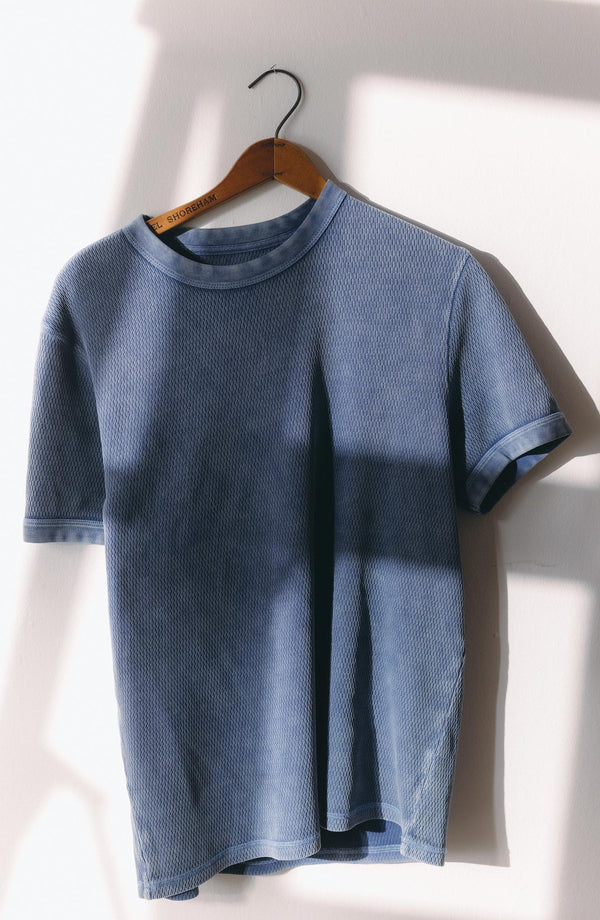 editorial image of The Organic Cotton Short Sleeve Crew in Washed Blue Waffle hanging