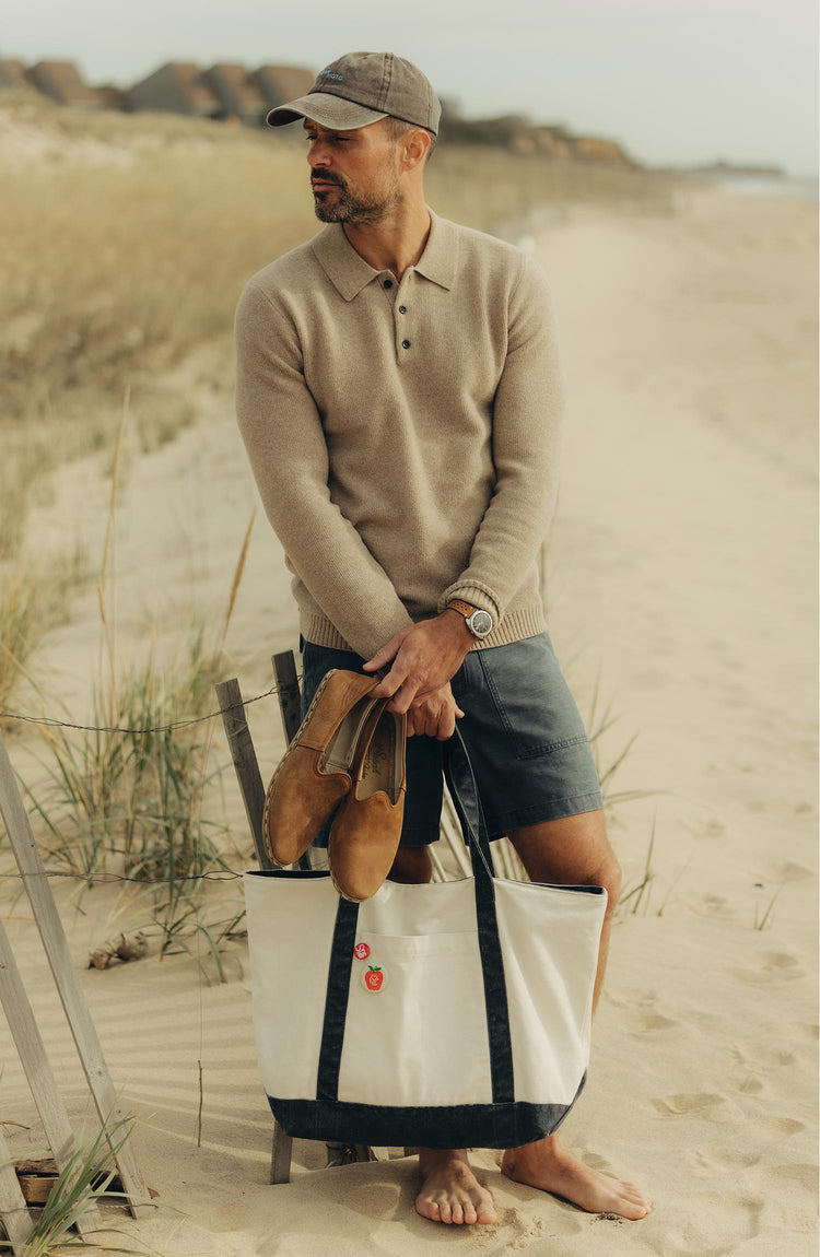 fit model walking wearing The Schooner Tote in Seeded Natural Chipped Canvas