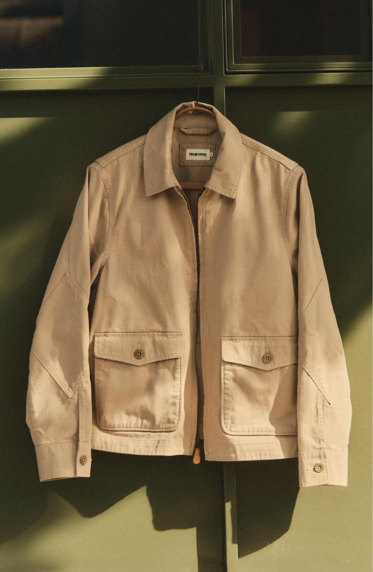 editorial image of The Airman Jacket in Organic Khaki Foundation Twill hanging