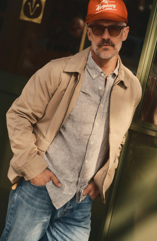 fit model showing off The Airman Jacket in Organic Khaki Foundation Twill