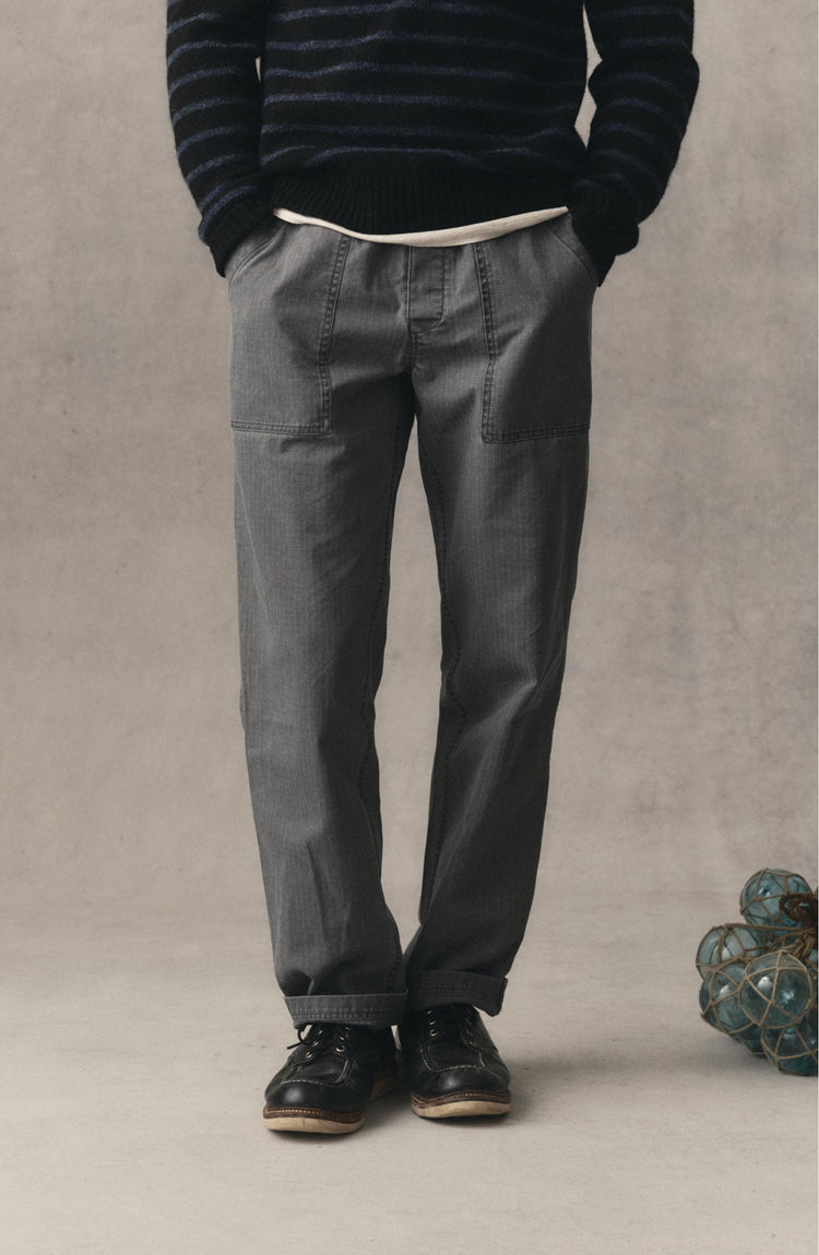 fit model posing in The Breakwater Pant in Dark Grey Ripstop