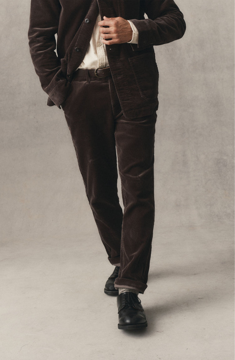 fit model posing in The Carnegie Pant in Soil Corduroy