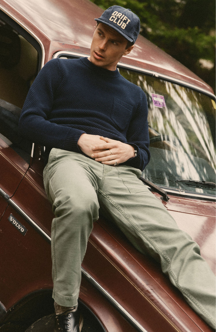 fit model posing in The Crawford Crew Sweater in Navy