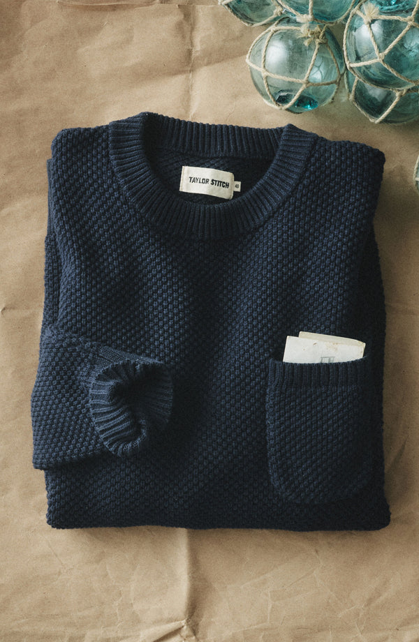 folded flatlay of The Crawford Crew Sweater in Navy