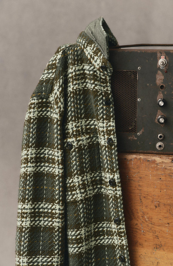 editorial image of The Cutter Overshirt in Buzzard Check hanging
