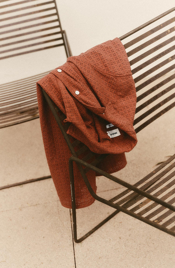 editorial image of The Davis Shirt in Driftwood Eyelet on a chair