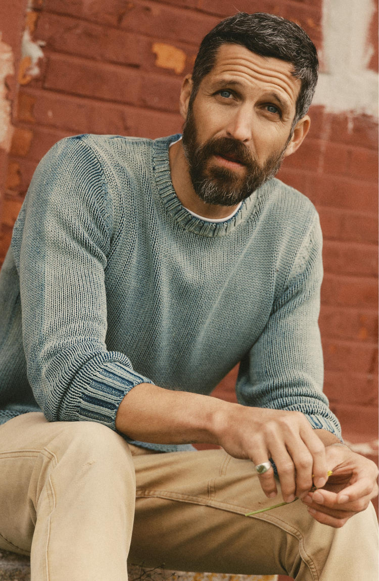 fit model posing in The Dory Crew Sweater in Washed Indigo