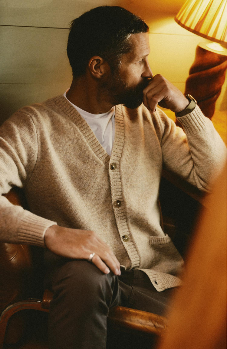 fit model posing in The Eastmoor Cardigan in Oatmeal Wool