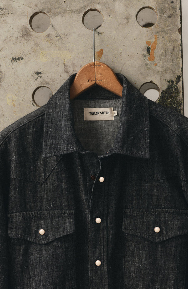 editorial image of The Glacier Shirt in Black Indigo Hemp Denim hanging
