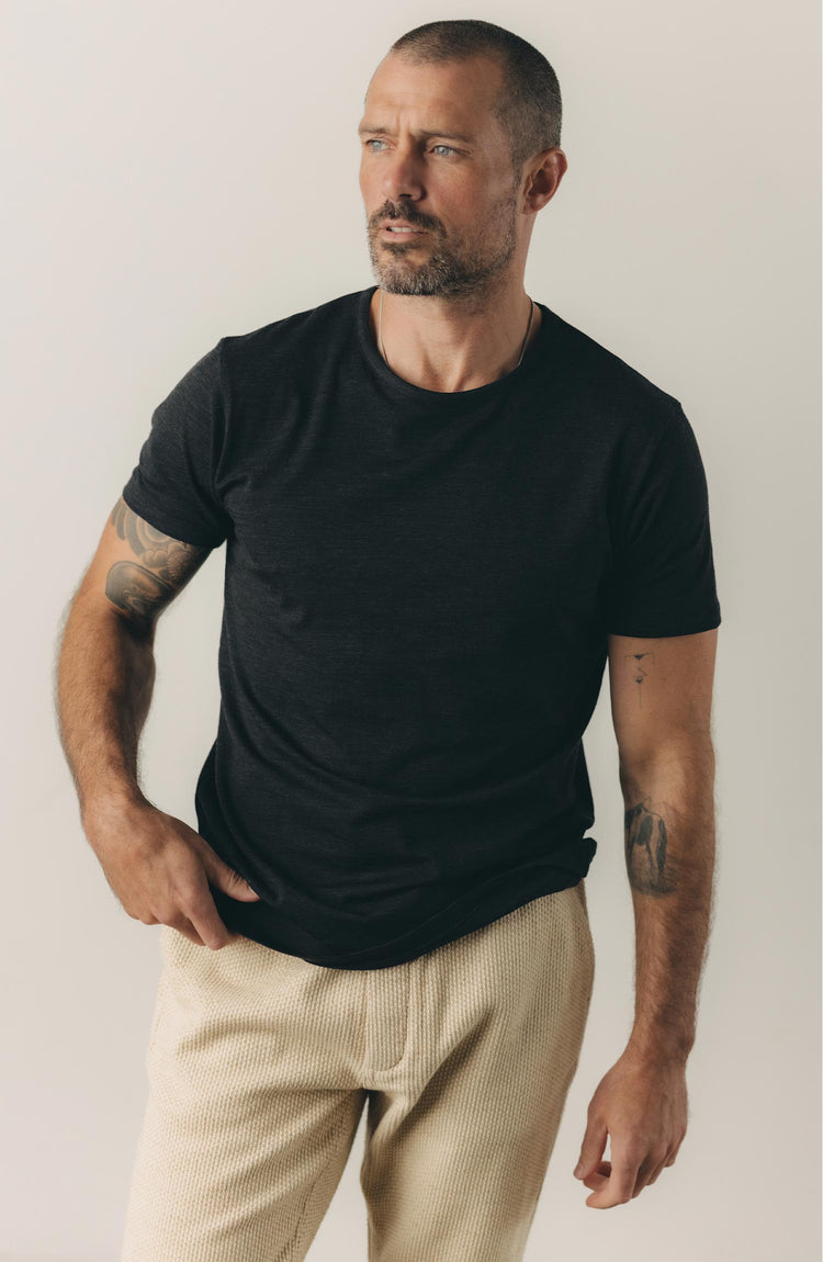 our guy rocking the merino tee near the beach
