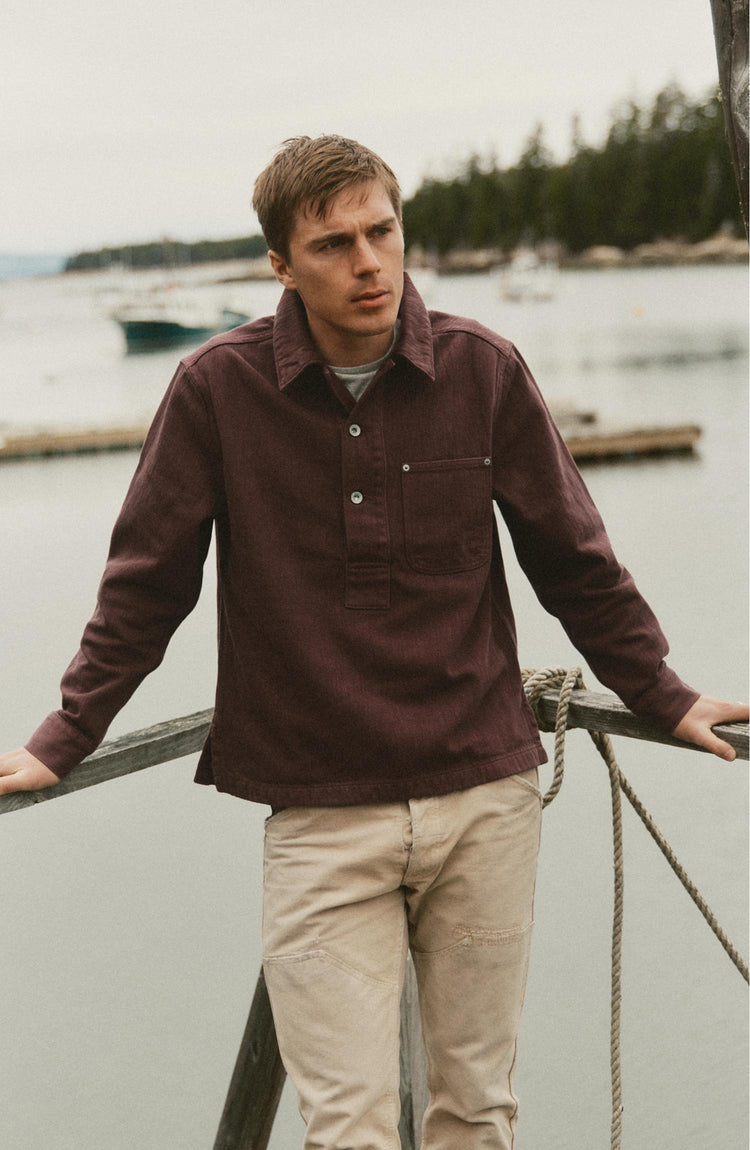 fit model posing in The Milton Overshirt in Burgundy Slub Denim