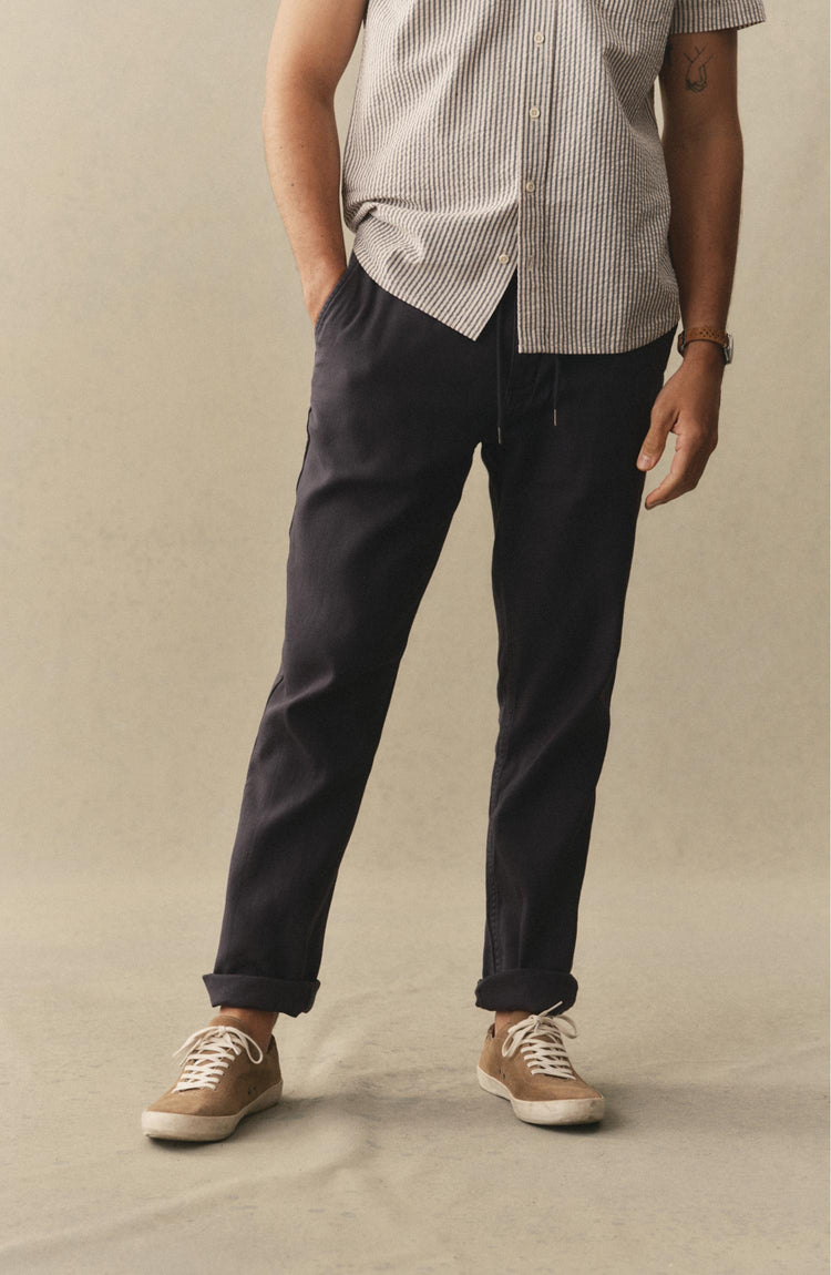 fit model posing in The Roamer Pant in Navy Broken Twill