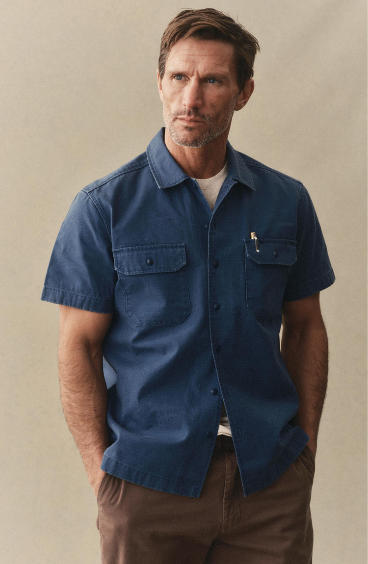 fit model posing in The Short Sleeve Mechanic Shirt in Atlantic Ripstop
