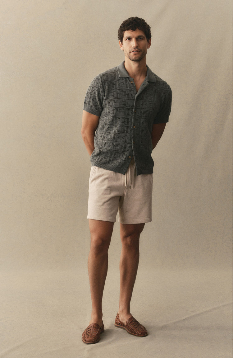 fit model posing in The Sunset Short in Heather Oat Terry